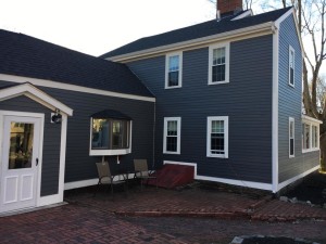 newly renovated house with blue exterior siding
