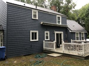 Back of the home with new siding shingles