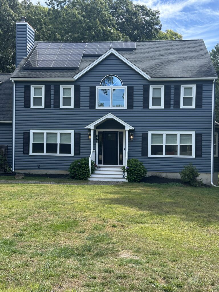 exterior of two story house blue vinyl siding